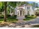 Charming two-story home with lush landscaping, a private driveway, and a red tile roof at 401 Peachtree Battle Nw Ave, Atlanta, GA 30305