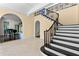 Elegant foyer showcasing grand staircase, arched doorway, and access to multiple rooms at 401 Peachtree Battle Nw Ave, Atlanta, GA 30305