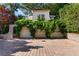 Three-car garage with climbing vines offers ample parking and beautiful curb appeal at 401 Peachtree Battle Nw Ave, Atlanta, GA 30305