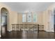 Hallway with decorative railing and a chandelier above at 401 Peachtree Battle Nw Ave, Atlanta, GA 30305