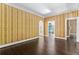Spacious living room features hardwood floors, designer wallpaper, and convenient access to a bonus room at 401 Peachtree Battle Nw Ave, Atlanta, GA 30305