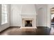 Bright living room highlighting the fireplace, hardwood floors, and bright natural light at 401 Peachtree Battle Nw Ave, Atlanta, GA 30305