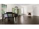 Spacious living room with hardwood floors, fireplace, and grand piano at 401 Peachtree Battle Nw Ave, Atlanta, GA 30305