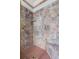 Spacious shower featuring luxurious marble tiling, brass hardware, and a built-in bench at 401 Peachtree Battle Nw Ave, Atlanta, GA 30305