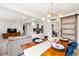 Open concept dining area with stylish lighting and view to the kitchen and living area at 674 Atlanta Se Ave, Atlanta, GA 30312