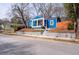 Charming blue bungalow with a cozy front porch, bright yellow door, and landscaped front yard at 674 Atlanta Se Ave, Atlanta, GA 30312