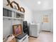 Clean laundry room with shelving, modern washer/dryer, and an abundance of light at 674 Atlanta Se Ave, Atlanta, GA 30312