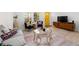 Bright, open living room with hardwood floors, modern decor, and a colorful yellow door at 674 Atlanta Se Ave, Atlanta, GA 30312