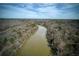 Scenic aerial view of a wide river flowing through a wooded area, showcasing the natural beauty at 0 Winterthur, Sandy Springs, GA 30328