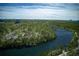 Stunning aerial view of lush green landscape with a beautiful river and city skyline in the distance at 0 Winterthur, Sandy Springs, GA 30328