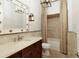 Warm bathroom with tiled vanity, tub, shower and warm lighting at 0 Winterthur, Sandy Springs, GA 30328