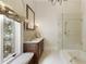 Bright bathroom featuring a tub, shower, window, and vanity at 0 Winterthur, Sandy Springs, GA 30328