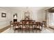Formal dining room featuring a long table, chandelier, and white paneled walls at 0 Winterthur, Sandy Springs, GA 30328