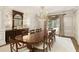 Elegant dining room showcases hardwood floors, a crystal chandelier, and decorative wall paneling at 0 Winterthur, Sandy Springs, GA 30328