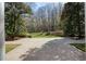 Expansive brick driveway surrounded by mature trees and lush landscaping at 0 Winterthur, Sandy Springs, GA 30328