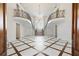 Grand foyer with a staircase, decorative chandelier, and patterned tile flooring at 0 Winterthur, Sandy Springs, GA 30328