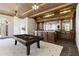 Game room with a pool table and wet bar, featuring a decorative tin ceiling at 0 Winterthur, Sandy Springs, GA 30328