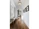 Bright hallway with hardwood floors, white walls, natural light, and views into the next room at 0 Winterthur, Sandy Springs, GA 30328