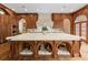 Custom kitchen island with marble countertop and built-in dog beds underneath at 0 Winterthur, Sandy Springs, GA 30328