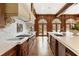 A gourmet kitchen features wood cabinets, marble countertops, and high-end stainless steel appliances at 0 Winterthur, Sandy Springs, GA 30328