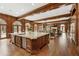 Gourmet kitchen featuring an island, high-end appliances, custom cabinets and wood floors at 0 Winterthur, Sandy Springs, GA 30328