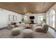 Bright living room with fireplace, detailed ceiling, neutral furniture, and archways at 0 Winterthur, Sandy Springs, GA 30328