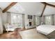 Bright main bedroom with hardwood floors, fireplace, wood beams, and balcony access at 0 Winterthur, Sandy Springs, GA 30328