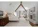 Bright bedroom with hardwood floors, fireplace, wood beams, and an elegant dresser at 0 Winterthur, Sandy Springs, GA 30328