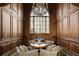Cozy sitting area with wood paneling, large windows, and comfortable seating under a chandelier at 0 Winterthur, Sandy Springs, GA 30328