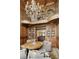 Elegant seating area features a chandelier and balcony overlooking comfortable seating with a round table at 0 Winterthur, Sandy Springs, GA 30328