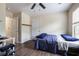 Neutral bedroom with ceiling fan, natural light, and door to hallway at 120 Centennial Ridge Dr, Acworth, GA 30102