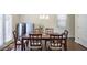 Dining room with a chandelier, hardwood floors, and a dining table with chairs near a sliding glass door at 120 Centennial Ridge Dr, Acworth, GA 30102