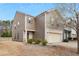 Two-story home with neutral siding, brick accents, an attached two-car garage, and a well-maintained front yard at 120 Centennial Ridge Dr, Acworth, GA 30102