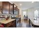 Modern kitchen features stainless steel appliances, granite countertops, and dark wood cabinetry at 120 Centennial Ridge Dr, Acworth, GA 30102