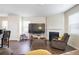 Comfortable living room with a large TV, fireplace, modern furniture, and plenty of natural light at 120 Centennial Ridge Dr, Acworth, GA 30102