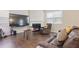 Comfortable living room with a large TV, fireplace, modern furniture, and plenty of natural light at 120 Centennial Ridge Dr, Acworth, GA 30102