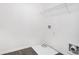 A bright laundry area with white walls and dark floors featuring the hookups and rack for organization at 2398 Chancery Mill Ln, Buford, GA 30519
