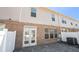 Brick patio area with white fence and door to unit at 2398 Chancery Mill Ln, Buford, GA 30519