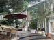 Relaxing backyard patio with mature trees, dining set, and comfortable seating, great for outdoor entertaining at 294 Hascall Nw Rd, Atlanta, GA 30309