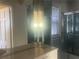 Bathroom featuring a large vanity, mirrored cabinet, and shower-tub combo with glass doors at 294 Hascall Nw Rd, Atlanta, GA 30309