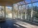 Bright sunroom with glass ceiling and walls providing lots of natural light and views of the outdoors at 294 Hascall Nw Rd, Atlanta, GA 30309