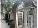 Charming sunroom with arched windows and a rustic exterior, perfect for enjoying the outdoors year-round at 294 Hascall Nw Rd, Atlanta, GA 30309