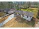 An aerial view of a charming home with a detached garage and long driveway at 3235 Bluebird Ln, Decatur, GA 30032