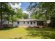 Large backyard featuring a newly constructed deck with sliding glass doors, perfect for entertaining guests at 3235 Bluebird Ln, Decatur, GA 30032