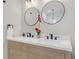 Modern bathroom with double vanity, framed mirrors, and a view of the shower at 3235 Bluebird Ln, Decatur, GA 30032