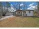 Attractive single-Gathering home featuring a freshly painted exterior and manicured lawn at 3235 Bluebird Ln, Decatur, GA 30032