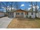 Charming single-story home with a welcoming front porch and modern exterior paint scheme at 3235 Bluebird Ln, Decatur, GA 30032