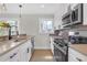 Well-equipped kitchen featuring stainless steel appliances, ample counter space, and natural light at 3235 Bluebird Ln, Decatur, GA 30032