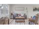Cozy living room with comfortable seating, modern decor, and large windows at 3235 Bluebird Ln, Decatur, GA 30032