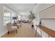 Open-concept living room featuring stylish decor, light wood floors, and abundant natural light at 3235 Bluebird Ln, Decatur, GA 30032